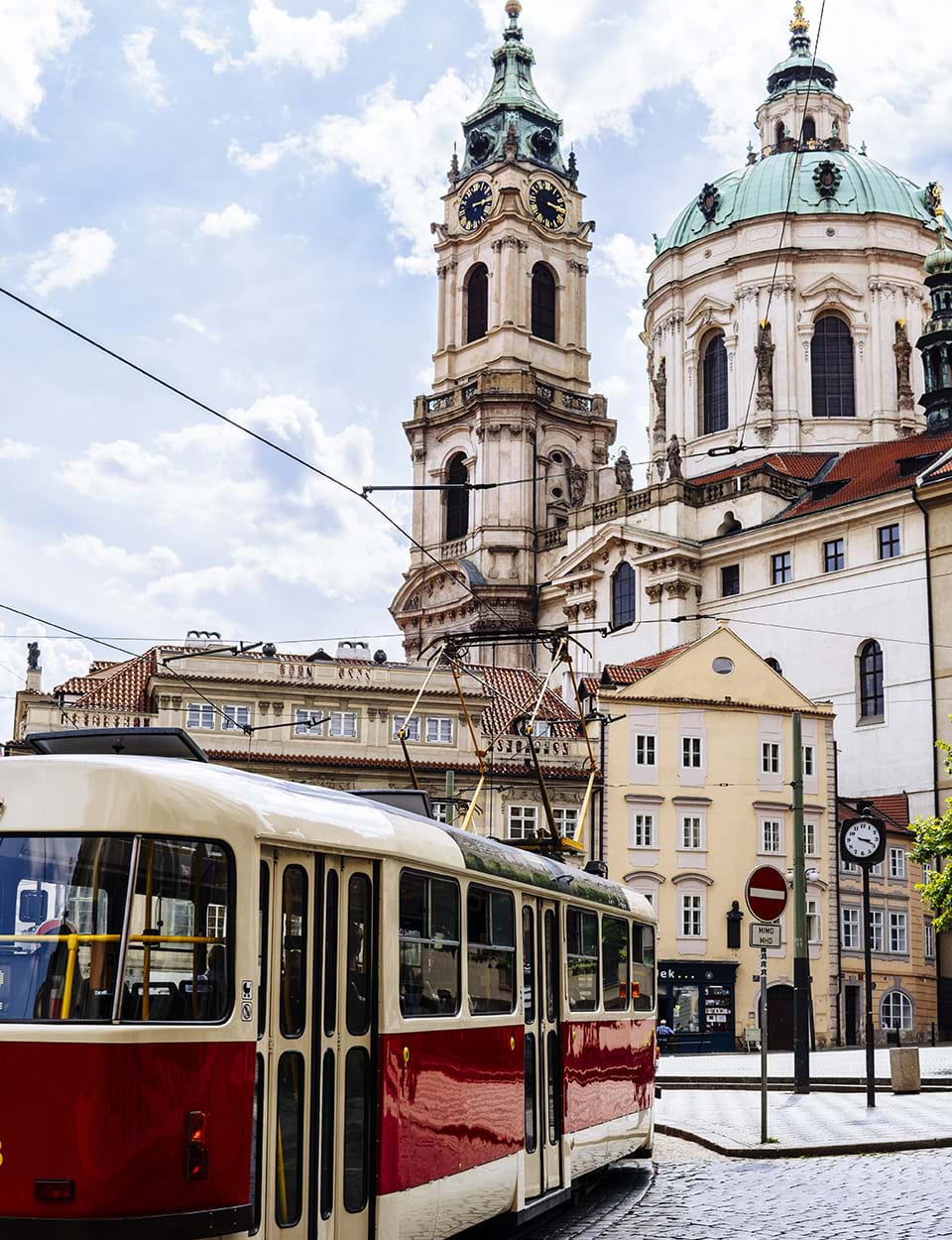 red tram in a city centre abroad